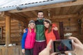 People Taking Photo On Smart Phone Group Wooden Country Mountain House Winter Snow Resort