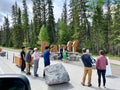 People taking the photos in front of the Banff Sign in Banff Natiaonal Park in Canada Royalty Free Stock Photo