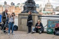 People taking photos with a sign for Queen's Walk while queuing on South Bank to see the Queen Royalty Free Stock Photo