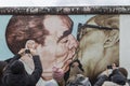 Famous mural and people at the East Side Gallery in Berlin