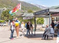 People are taking pictures with ice cream cone at the lakefront of Locarno. Royalty Free Stock Photo