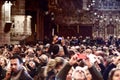 People taking pictures in the spectacle of cathedral of Palma de Majorca.