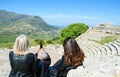 People taking selfie photo at Ancient Greek theater at Segesta. Royalty Free Stock Photo