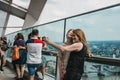 People taking selfies on an open air balcony in Sky Garden, London, UK. Royalty Free Stock Photo