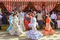 People taking a walk and enjoying at the Seville`s April Fair.