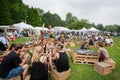 People talking in the food court area of popular music festival