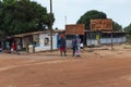 People talking near a barbershop in a slum at the city of Bissau, in Guinea-Bissau