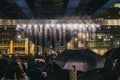 People talking photos of Bit.fall installation by Julius Popp in Canary Wharf, London, UK