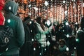 People talking photos inside Winter Lights festival in Canary Wharf, London, UK