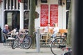 People talking and relaxing at a coffeshop terrace in Amsterdam, Netherlands Royalty Free Stock Photo