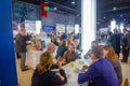 People talking to each other on Frankfurt Book Fair may be listening author