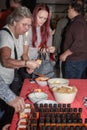 People taste different hot sauces made from different types of peppers that are grown in the adjacent greenhouse