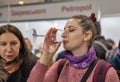 People tasting wine at exhibition in Kyiv, Ukraine