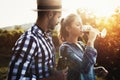 People tasting wine in vineyard