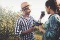 People tasting wine in vineyard