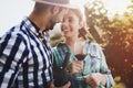 People tasting wine in vineyard