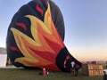 People and team getting ready to inflate and fly hot air balloon.