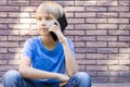 People, technology and communication concept. Child talking on cell phone Royalty Free Stock Photo