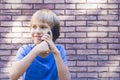 People, technology and communication concept. Child talking on cell phone Royalty Free Stock Photo