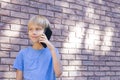 People, technology and communication concept. Child talking on cell phone Royalty Free Stock Photo
