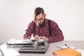 People and technology concept - Portrait of bearded man in plaid shirt typing over grey background Royalty Free Stock Photo