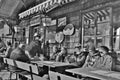 People on the terrace of a mountain hut in winter. Austria, Europe. Royalty Free Stock Photo