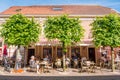 People on terrace in old town of fortified city of Woudrichem, N