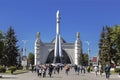 People on the territory of VDNH at the pavilion `Space` and the layout of the launch vehicle `East`. Moscow,