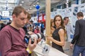 People testing professional photographic cameras on Sony booth. Kyiv, Ukraine