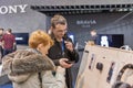 People testing smartphones on Sony booth. CEE 2019, Kyiv, Ukraine