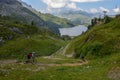 People on their mountain bikes going down the path from Jochpass Royalty Free Stock Photo