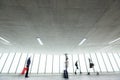 People with their suitcases walking along a corridor Royalty Free Stock Photo