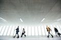 People with their suitcases walking along a corridor Royalty Free Stock Photo