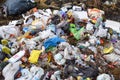 People throw away plastic bottles, bags and food waste, leave trash on the street after Royalty Free Stock Photo