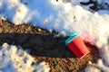 People throw coffee cup on snow. The problem of environmental pollution. Pile of abandoned garbage on the street, including food