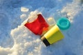 People throw coffee cups on snow. A pile of abandoned garbage on the street. Scattered food waste, cans of cola, beverage, fast Royalty Free Stock Photo