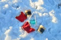 People throw coffee cups on snow. A pile of abandoned garbage on the street. Scattered food waste, cans of cola, beverage, fast Royalty Free Stock Photo