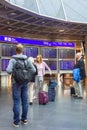 People at a timetable at an airport Royalty Free Stock Photo