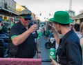 People toasting drinks on St Patrick`s Day in New Orleans Royalty Free Stock Photo