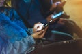 People together pointing finger on screen smartphone on background bokeh light in night atmospheric city, group adult hipsters fri Royalty Free Stock Photo