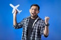 people with toothy smile holding paper cutting airplane Royalty Free Stock Photo