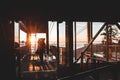 People at the top of Grouse Mountain Ski Resort inside the Skyride building at sunset