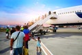 People tourist passager evening boarding a plane at airport