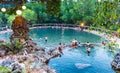 People tourists at Maquinit Hot Spring at Busuanga island near Coron town, Palawan