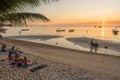 People and tourists resting on Sairee beach and watching the sunset and look on sea Royalty Free Stock Photo