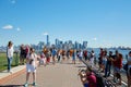 People and tourists shooting photos with New York skyline