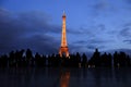 People and tourists walk on the Palais de Chaillot esplanade which is known as the esplanade of human rights after sunset.
