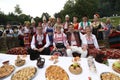 People in traditional authentic folk costumes on National folklore fair `Ledenika`