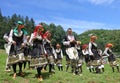 People in traditional authentic folklore costume a meadow near Vratsa, Bulgaria