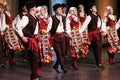 People in traditional folklore costumes perform folk dance Bulgarian Horo